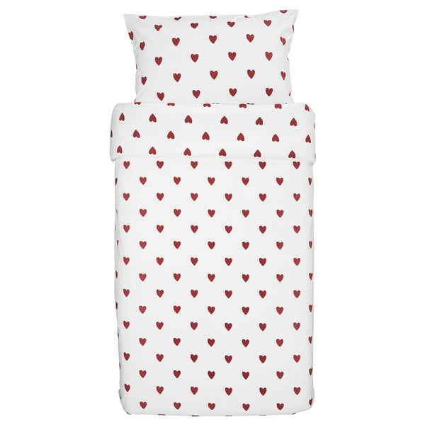 White childrens bedding set with red heart prints, made of cotton, includes duvet cover and pillowcase.