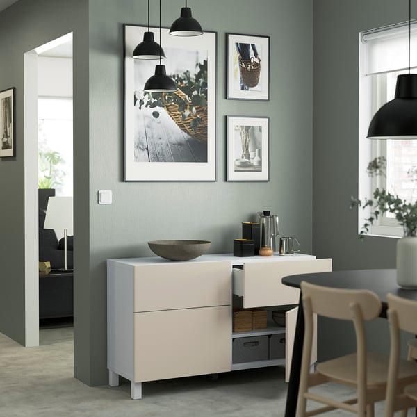 Modern kitchen with BESTÅ storage, drawers, photos, pendant lights, chair, and plants.