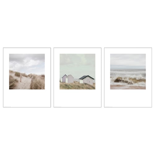 Three framed beach scenes in white frames. Left: golden sands, middle: pink beach huts, right: waves crashing.