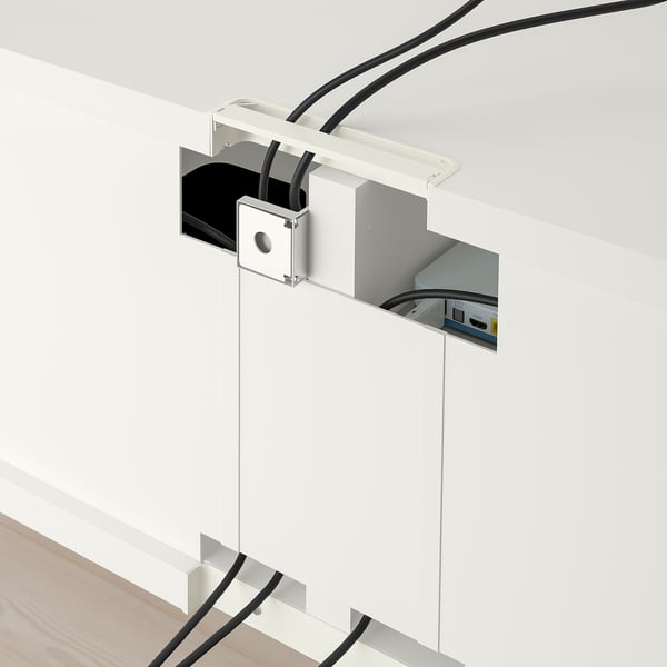 Wall-mounted shelf with visible cables and adjustable hinges.