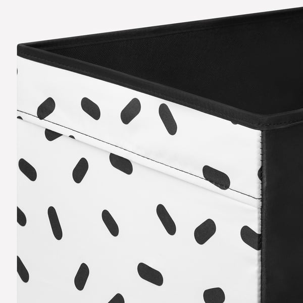 Black and white spotted storage box with sturdy, folded edges, showcasing quality design.