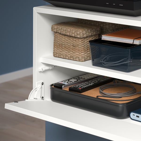 Wall-mounted storage with push-open door, baskets, and organised cables. Or wall storage: push-to-open, baskets, neat cables.