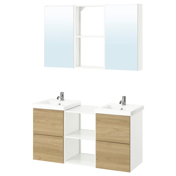 Modern bathroom vanity set in light wood and white; includes two sinks, faucets, and mirrored cabinets.