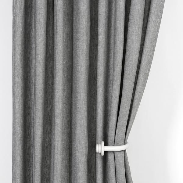 Black striped curtains tied back with white holders, allowing light through.