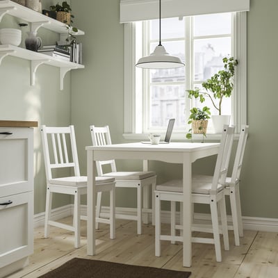Small, white HAUGA dining set with square table and slatted chairs for four, perfect for cosy kitchens or living rooms.