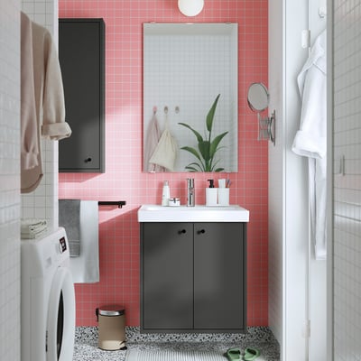 Modern bathroom with grey HAVBÄCK vanity, white sink, pink tiles, minimalist design, wall-mounted mirror.