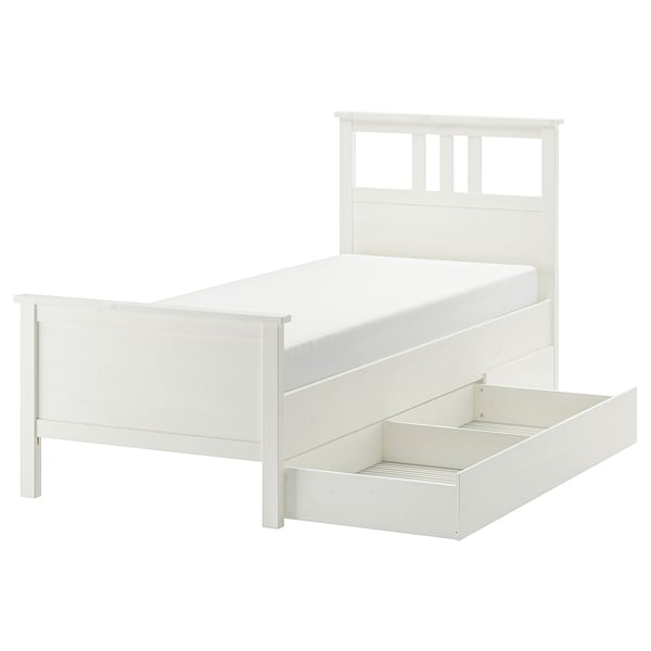 A white HEMNES bed with adjustable sides, a headboard, footboard, and under-bed storage drawers in a minimalist, rectangular design.