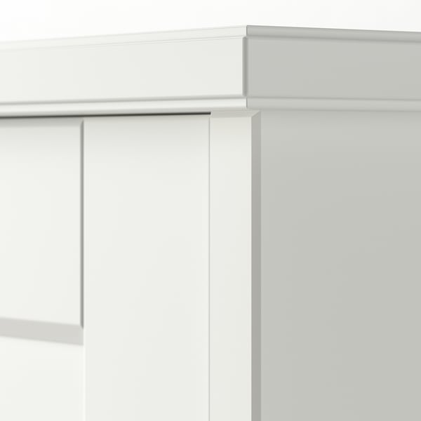 Stylish, white wooden desk with clean lines and robust build. Edge detailing and ample storage.