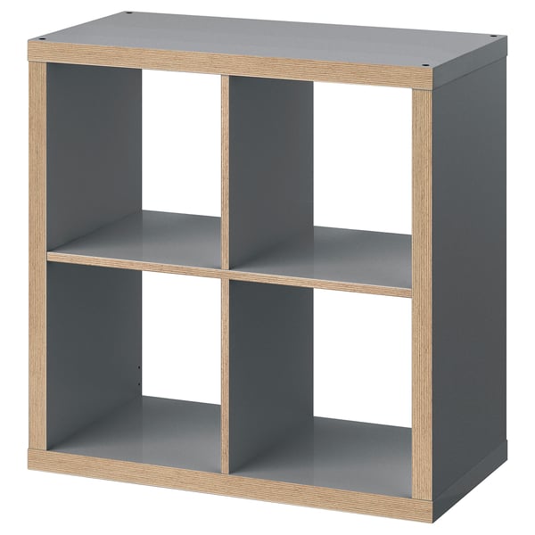 KALLAX grey cube shelf, three open compartments, sturdy board construction.
