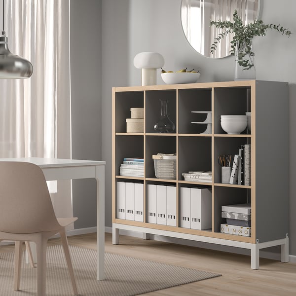 KALLAX shelving unit in grey & oak with books & decor