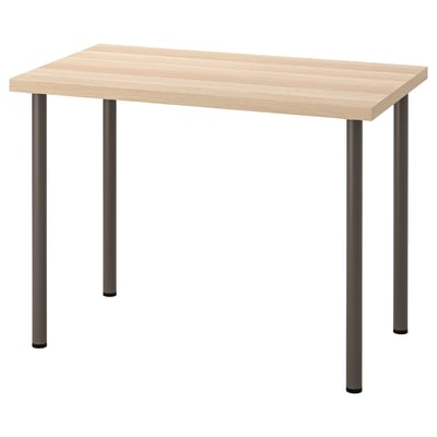 A LINNMON table with a light-colored wooden top and four dark metal legs. It is rectangular with a modern design.