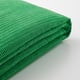 Bright green, folded textured fabric, soft and inviting, likely a bed cover.