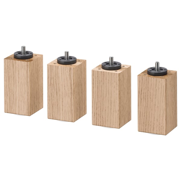 Four light brown wooden legs with black adjustable screws; square shape.