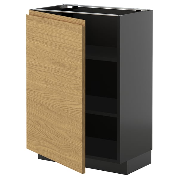 Dark grey framed kitchen cabinet with light wood door, partially open, revealing empty shelf.