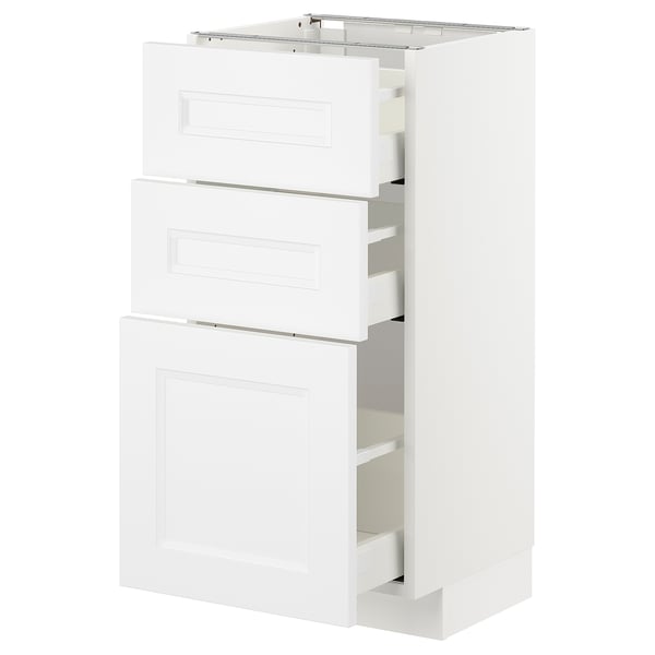 White ikea METOD kitchen unit with three open drawers and cabinet.