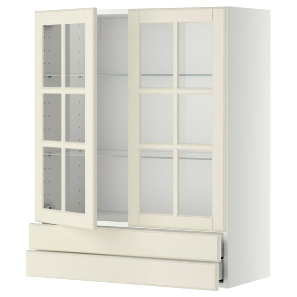 Off-white kitchen cabinet with glass doors, metal drawers, and wooden frame, traditional design.