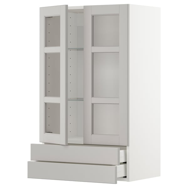 A white ikea METOD kitchen unit with glass doors and drawers.