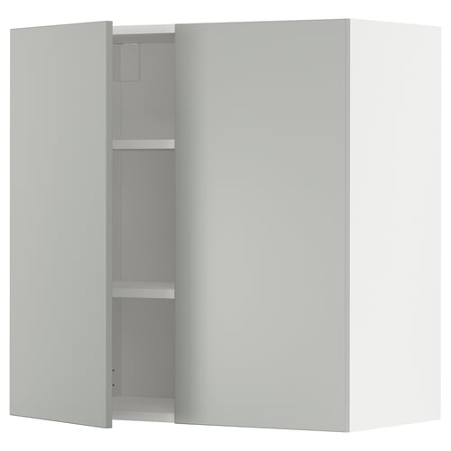 A white METOD wall cabinet with two doors and two shelves. The cabinet is modern and minimalist in design, featuring clean lines and a sleek finish.