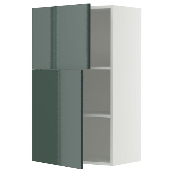 A white METOD kitchen cabinet with high-gloss green doors, hinged open, revealing inner shelves.