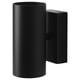 Black modern wall lamp NYMÅNE with cylindrical shade, emitting light upward and downward, made of aluminium and steel with a powder-coated finish.
