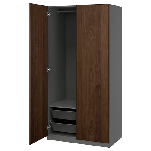 An open brown and gray PAX wardrobe with shelves and mesh baskets, featuring a modern design.