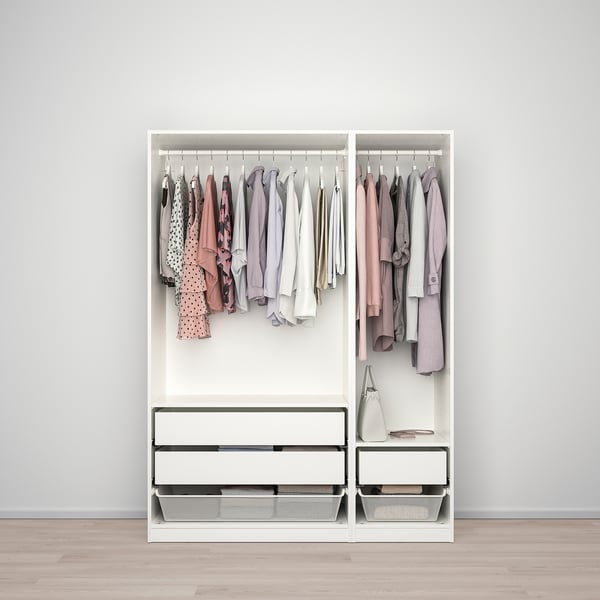Modern closet with clothes, shelves, and drawers.