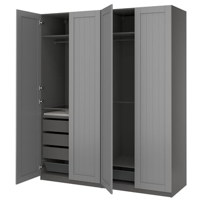A grey IKEA PAX wardrobe with open doors, revealing shelves and drawers.