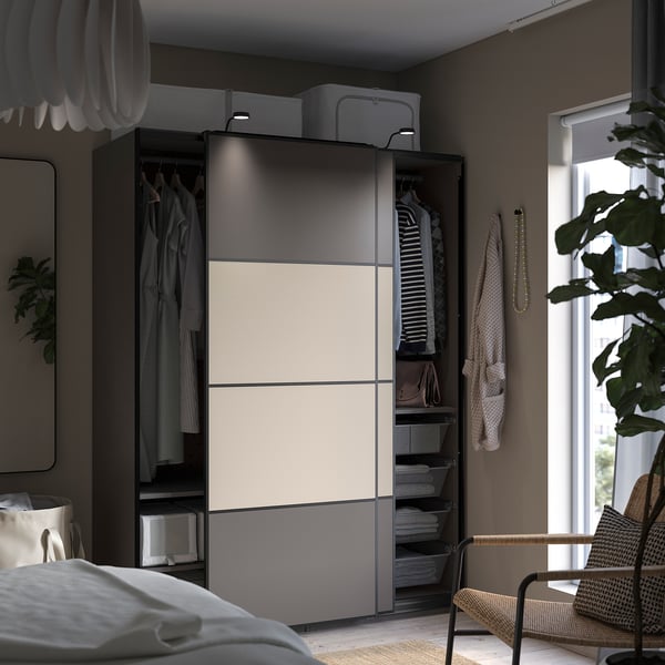 Bedroom with PAX wardrobe, white and grey, modern design, hanging clothes, shelves.