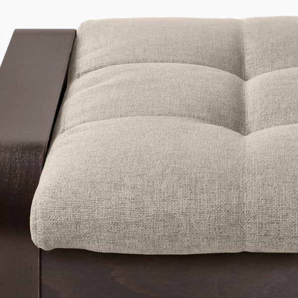 Close-up of cushioned seat and wooden armrest, clean, minimalist design, promises comfort and durability.