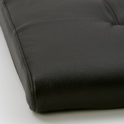 Soft black leather footstool, showcasing smooth, high-quality grain leather with a sturdy frame.