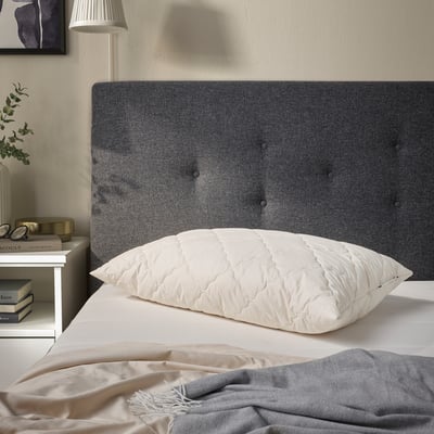 RÅDHUSVIN pillow: grey, grey linen headboard, white bed, cosy, natural fibres.