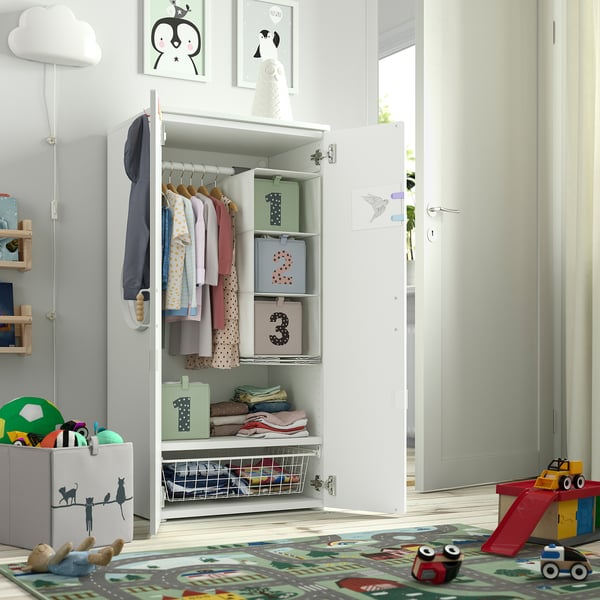 Kids wardrobe with clothes, toys, and shelves. Soft-close doors, adjustable interiors.