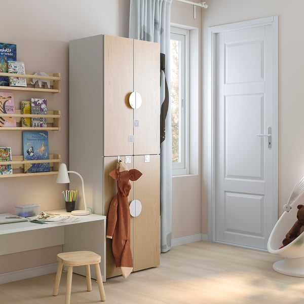 Modern childrens room with SMÅSTAD wardrobe in light wood, desk, stool, and bookshelves. Bright and organised space.