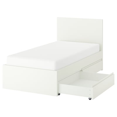 A white STORKLINTA bed with modern, minimalist design. It has a high headboard, two underbed storage drawers, and sturdy construction.