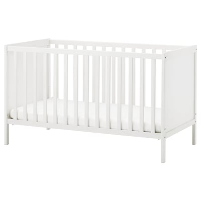 A white SUNDVIK baby cot with vertical slats, sturdy wooden construction, and adjustable base height.