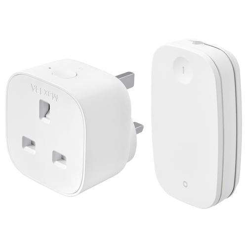 Two white ikea TRETAKT smart home devices: a compact square plug and a slim rectangular remote control.