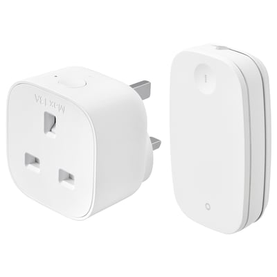 Two white ikea TRETAKT smart home devices: a compact square plug and a slim rectangular remote control.