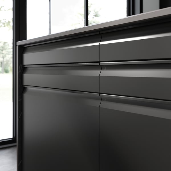 Modern kitchen with UPPLÖV black cabinets, sleek handles, and clean lines.