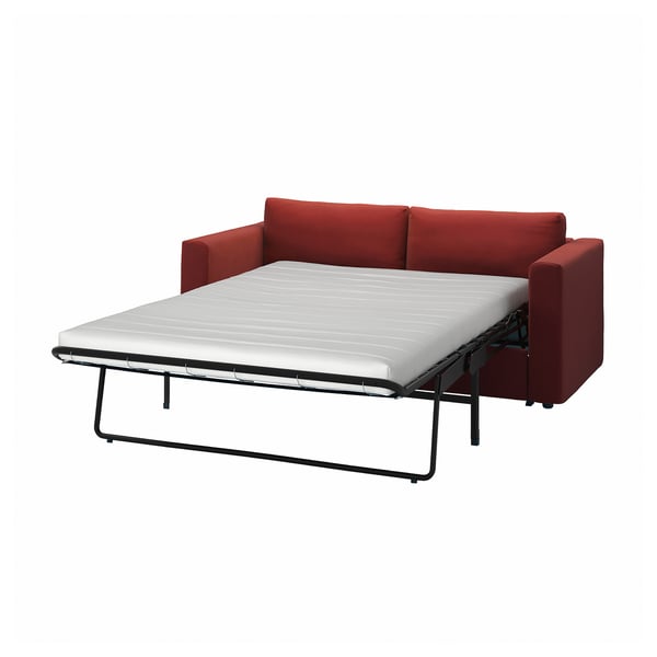 Red VIMLE sofa bed with firm white mattress, simple design.