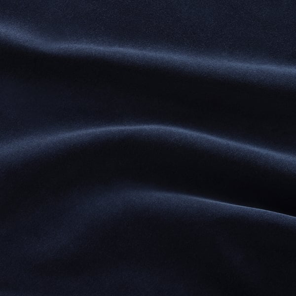 Dark blue sofa with smooth, soft fabric texture.