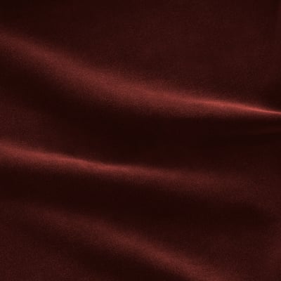 Luxurious deep red velvet sofa-bed, 10-year guarantee, thick foam mattress, removable washable cover.