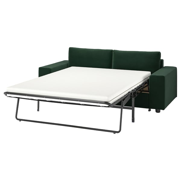 A dark green VIMLE sofa-bed with a white mattress, featuring a modern, sleek design with metal legs.