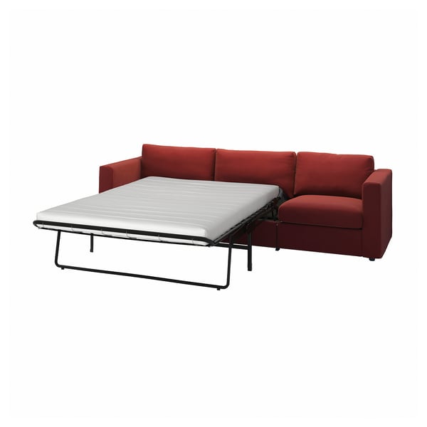 Red VIMLE sofa-bed with white mattress, modern design.