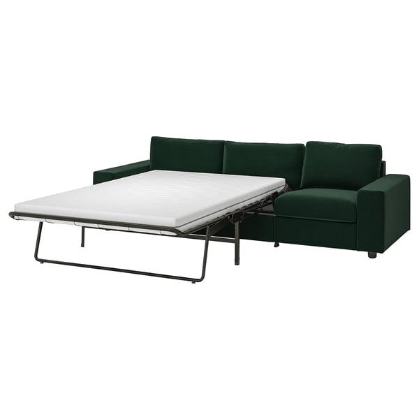 VIMLE dark green sofa-bed, modern design, sleek lines, padded cushions. Convertible, shows as bed.