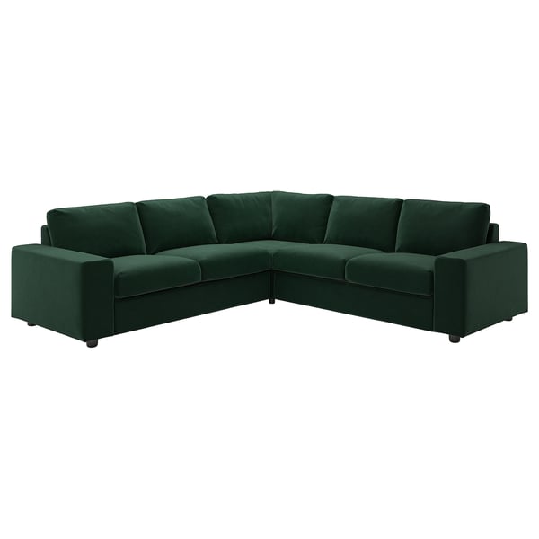 Emerald green modern l-shaped sectional sofa with deep cushions, sleek lines, and dark wooden legs.