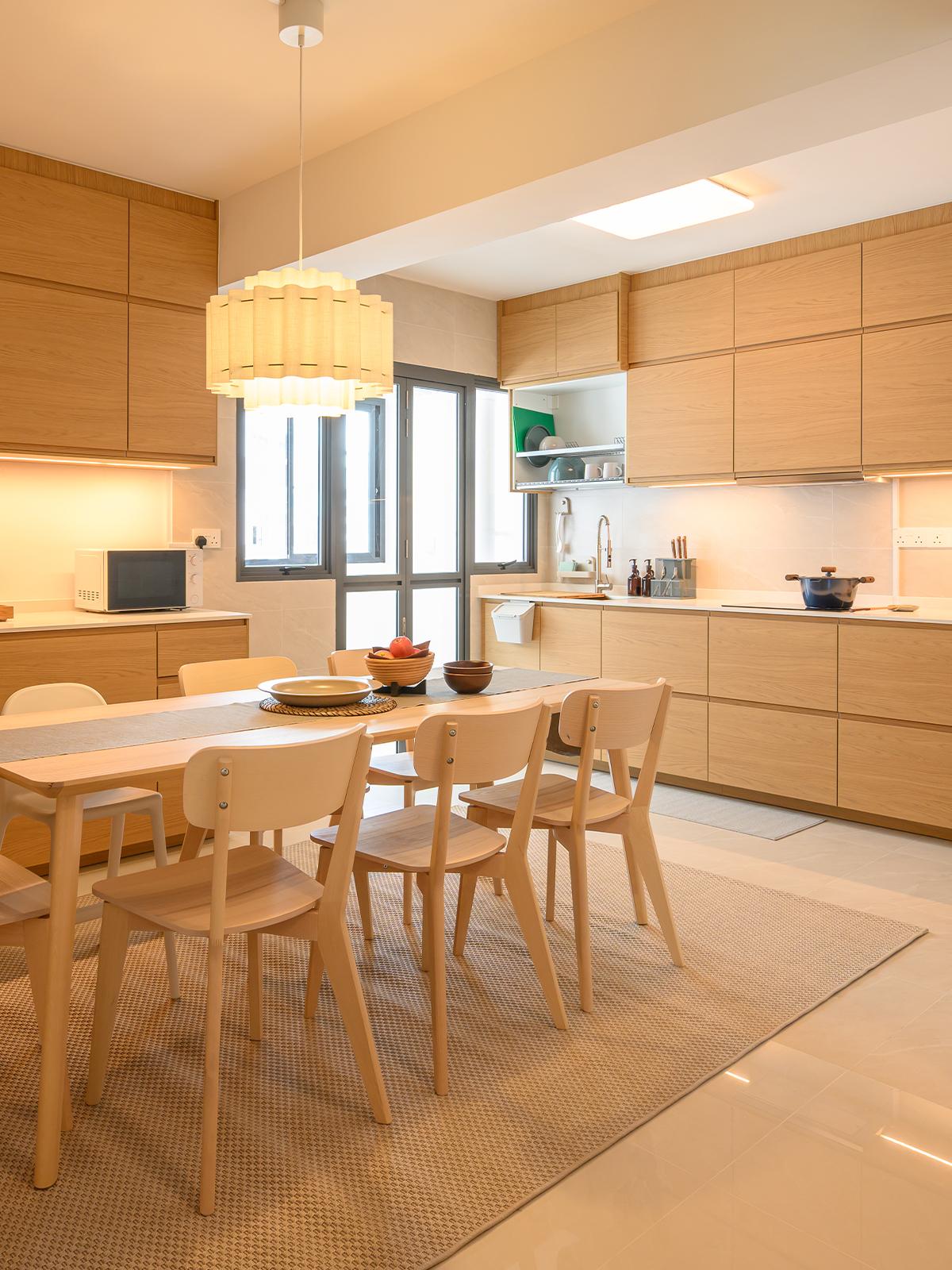 A 45 degree angle shot of homeowner's open concept kitchen & dining area - featuring METOD kitchen system and LISABO dining table and dining chairs.