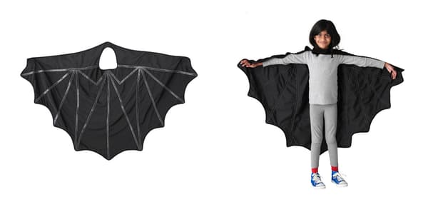 A bat cape displayed against a white background next to a child wearing the bat cape, also against a white background.