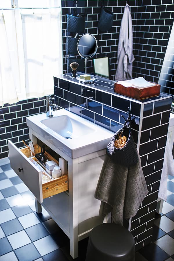 A bathroom design idea featuring a double sink and cabinet in the centre of the room.