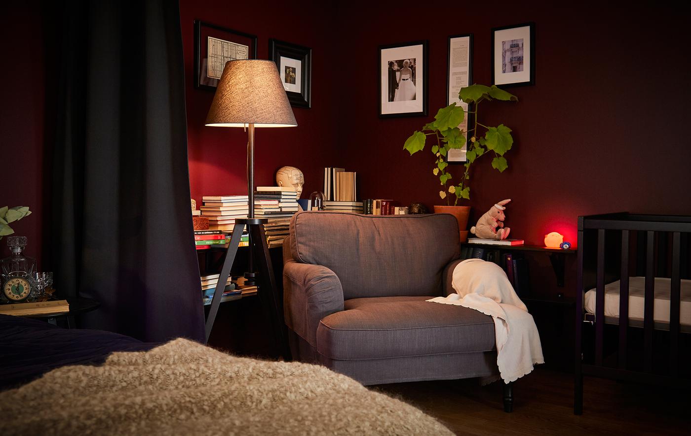 A bedroom late at night with a few soft lights on.