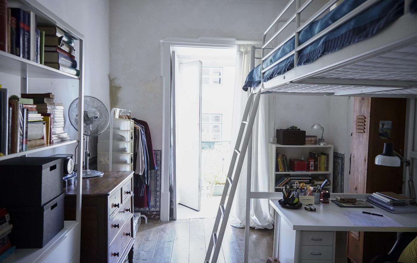 A bedroom with a loft bed, creating a studio feel that blends the needs of working and relaxing.